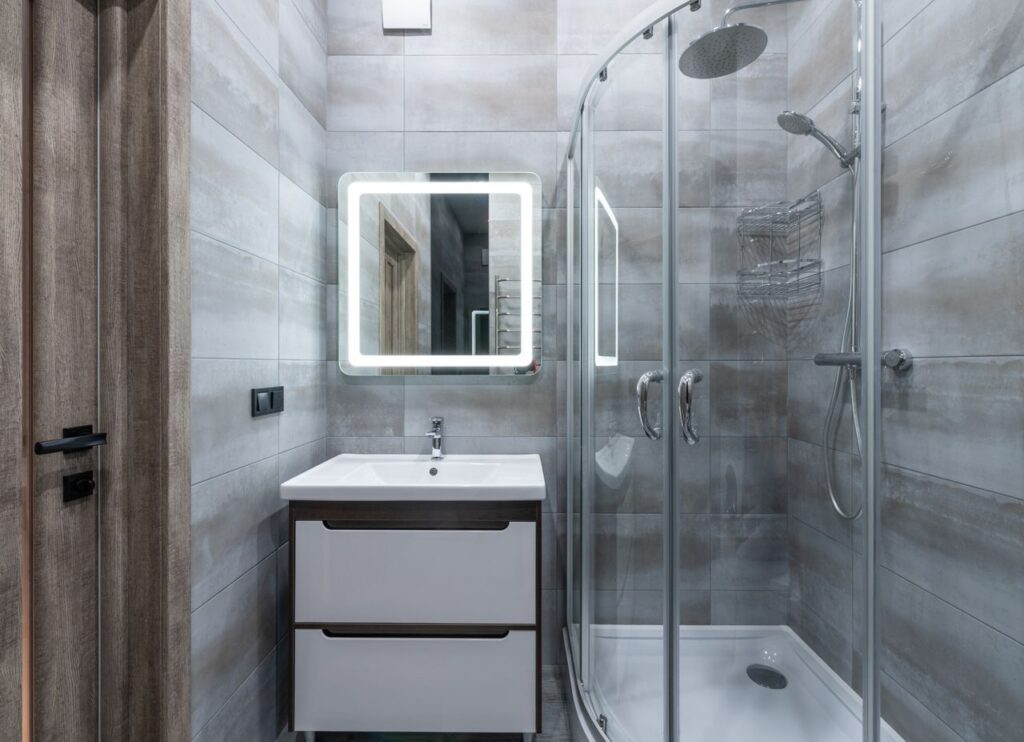Bright, spotless bathroom with a glass shower, free of mold and mildew