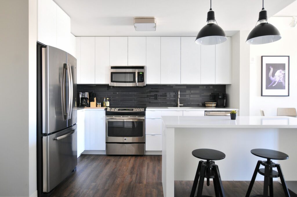 a spotless San Diego kitchen, white cabinets and stainless appliances